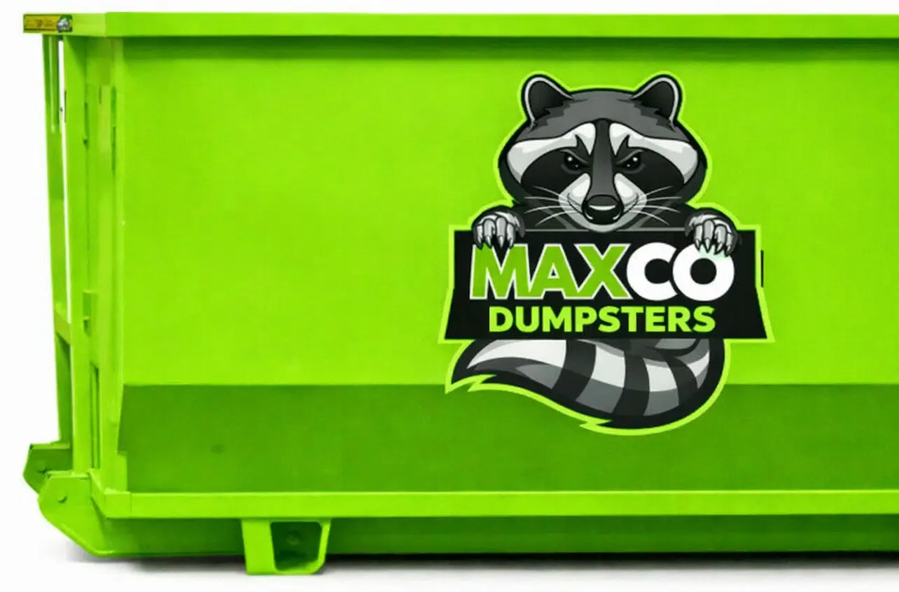 MAXCO Dumpsters owner standing beside a green MAXCO roll-off dumpster with the raccoon mascot in Florida