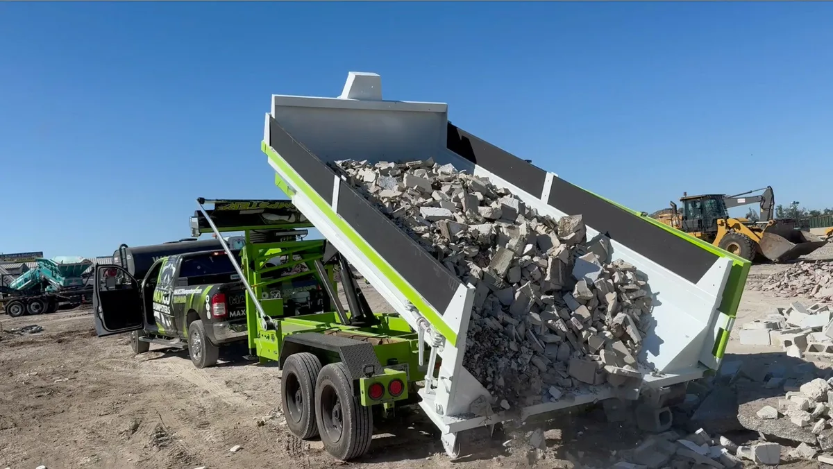 MAXCO dumpster loaded with concrete and heavy material debris