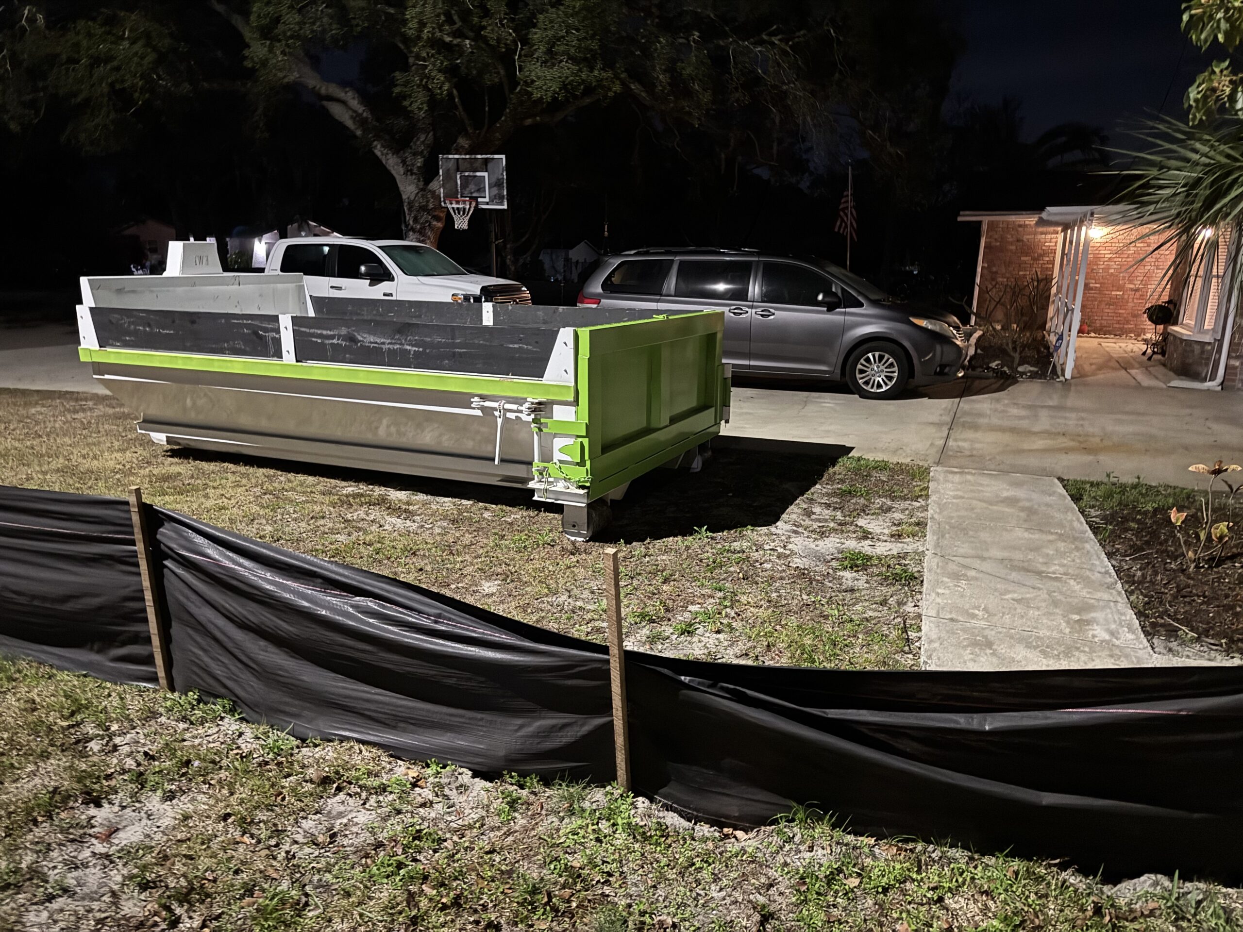 Concrete and Dirt Dumpster